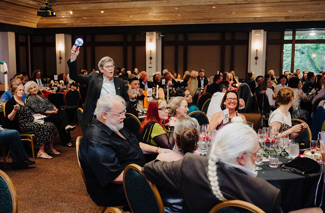 Auctioneer in action at Love Is Home Gala