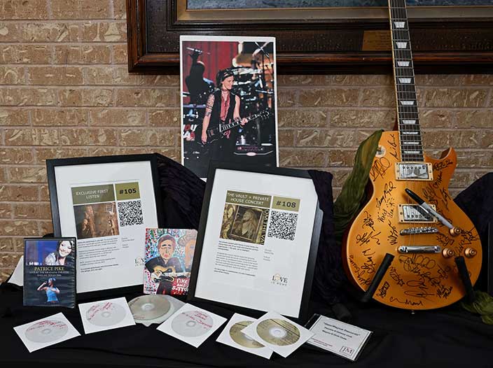 Silent and live auction items, including signed guitar